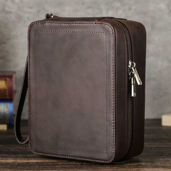 Roroos leather travel case holding a Rolex Submariner and sunglasses — ideal carry-on organizer