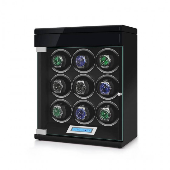 Angled view of black automatic watch winder showing 4 rotating winding slots and extra storage below