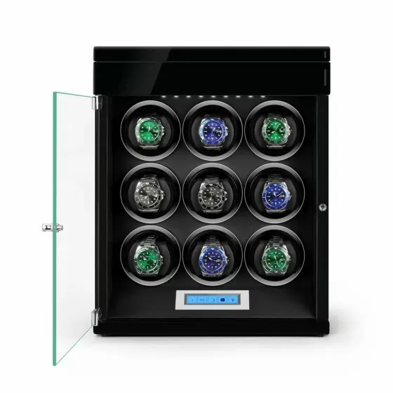 Open view of black automatic watch winder showing 4 rotating winding slots and extra storage below