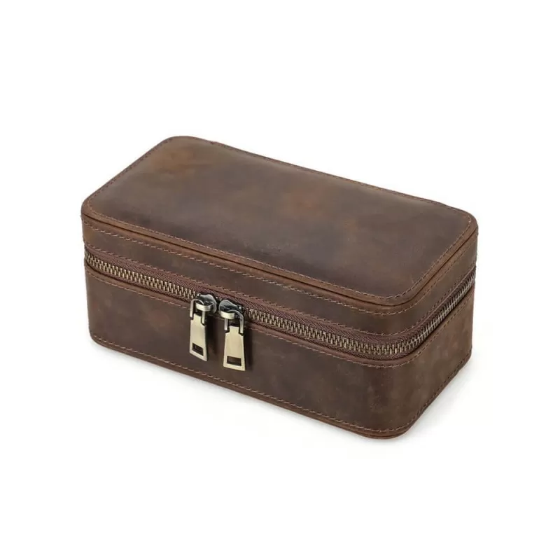 Roroos handmade leather travel jewellery and watch box open to show 3 suede-lined compartments holding a watch, ring, and necklace