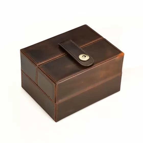 Leather mechanical watch case open showing 2 suede-lined padded cushions