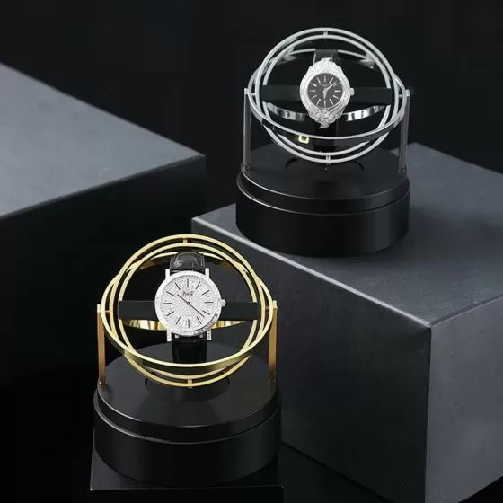 Luxury gold automatic watch winder with astronomy planet arm display on desk