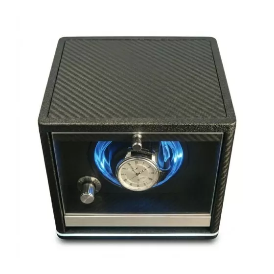Carbon fiber single watch winder viewed from above — open glass door showing LED cradle and memory foam pillow