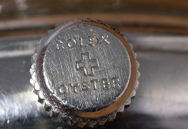 Rolex Cross Symbol